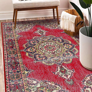 Close-up of Medallion Carpet showcasing intricate floral and scroll designs