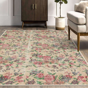 Close-up of Oushak Vintage Style Rug’s faded design and low-profile pile.
