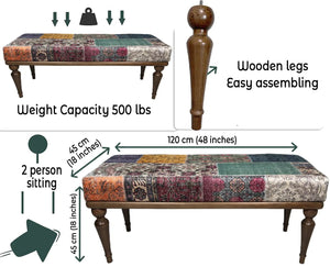 Close-up of patchwork fabric patterns on the upholstered bench