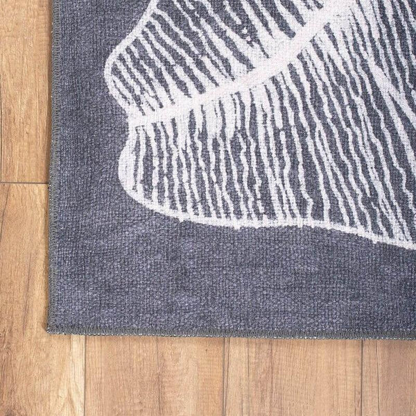 Close-up of the Elegant Leaf Rug’s leaf-inspired design and low-profile pile.