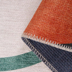 Close-up of the Orbital Elegance Rug’s elegant orbital design and low-profile pile.