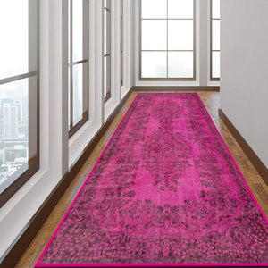 Close-up of the Vibrant Pink Rug’s bright color and low-profile pile.