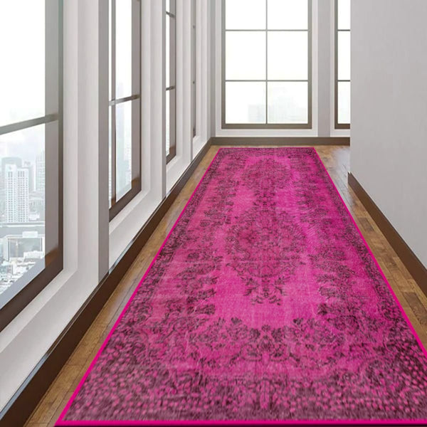 Close-up of the Vibrant Pink Rug’s bright color and low-profile pile.