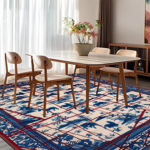 Dining room with a table and chairs on a patterned rug