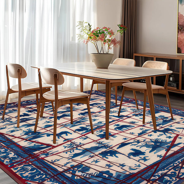 Dining room with a table and chairs on a patterned rug