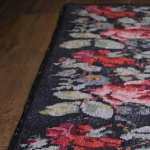 Custom-sized Moldovian Black Rug enhancing the decor of a sophisticated dining room