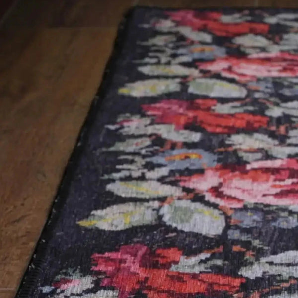Custom-sized Moldovian Black Rug enhancing the decor of a sophisticated dining room