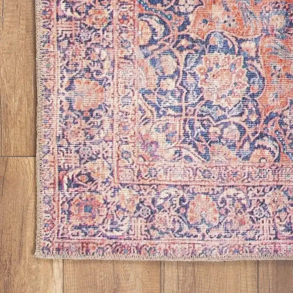 Custom-sized pink Persian rug enhancing the feminine decor of a home office.