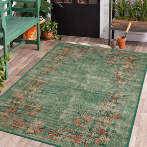 Green Antique Look Rug with vintage-inspired design in a classic living room.