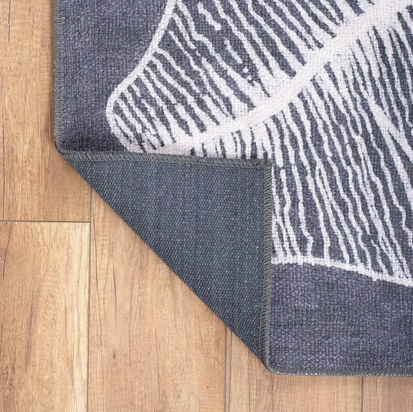 Hypoallergenic and family-friendly Elegant Leaf Rug in a cozy bedroom