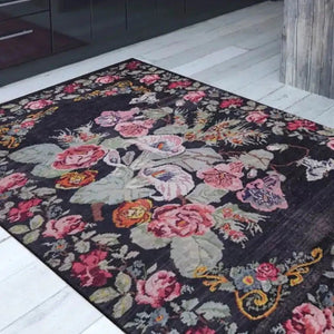 Moldovian Black Rug with traditional patterns in a luxurious living room.