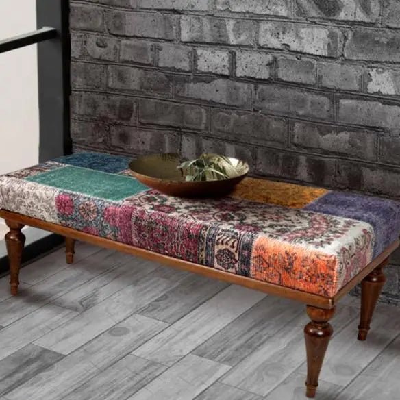 Vibrant patchwork upholstered bench with sturdy hornbeam wood legs.