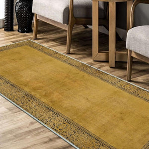 Yellow runner rug adding a bright, cheerful accent to a modern hallway